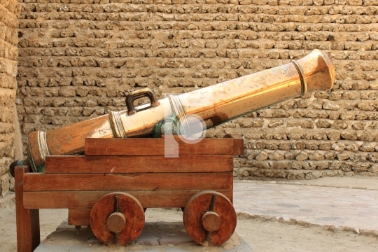 antique gold cannon in dubai museum, united arab emirates