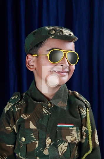 Asian / Indian Boy Dressed as a Soldier / Armed Forces Personnel