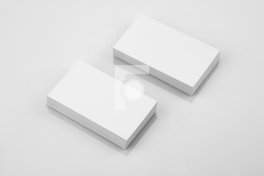 Blank Business Card Mockup on White Reflective Background