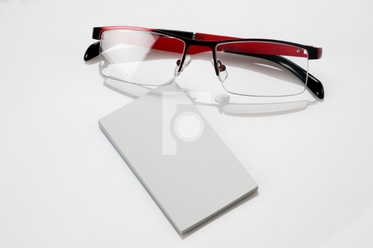 Blank business card with eyeglasses for mockup