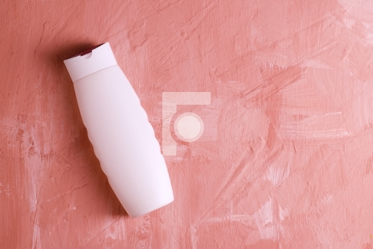 Blank White Product Mockup Plastic Bottle on Painted Textured Ba