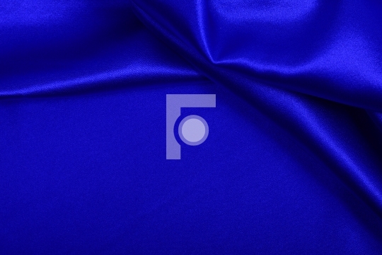 Blue colored satin fabric background