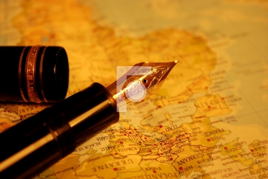 business traveller pen with world map in the background