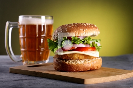 Fast Food Burger with a Beer Mug with yellow background