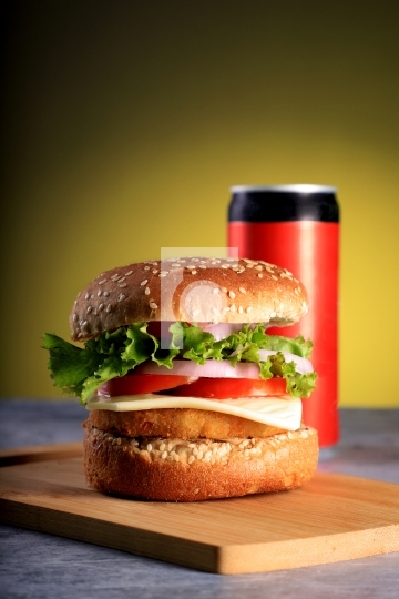 Fast Food Burger with a Cold Drink Can
