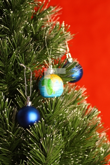 Globe as onament on christmas tree, christmas concept 