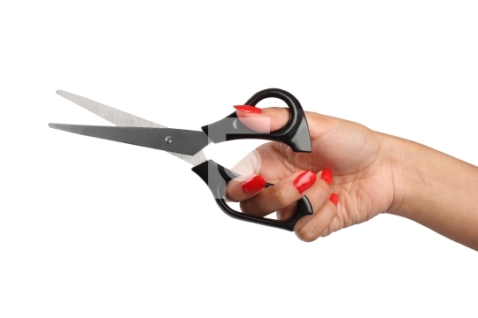 hand with red nail polish holding a scissor
