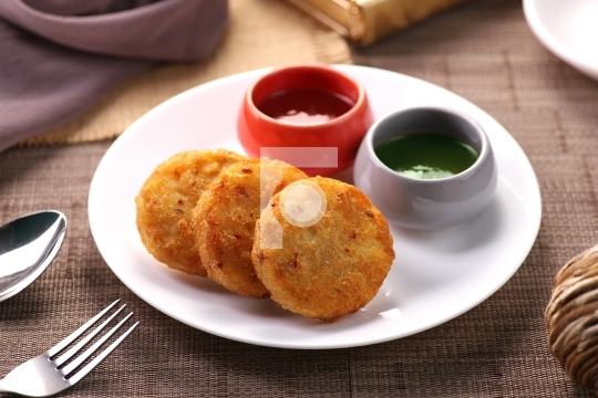 Indian Food - Aloo ki Tikki (Potato Patties) Served with Chutney