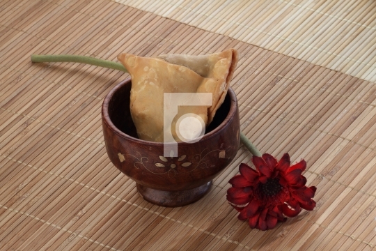 Indian Food Spicy Samosa with a flower