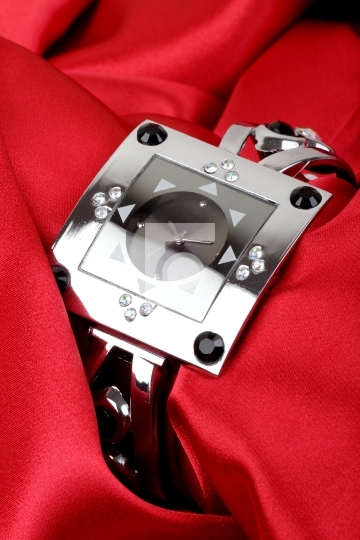 Luxury Wrist Watch on Red Satin Cloth