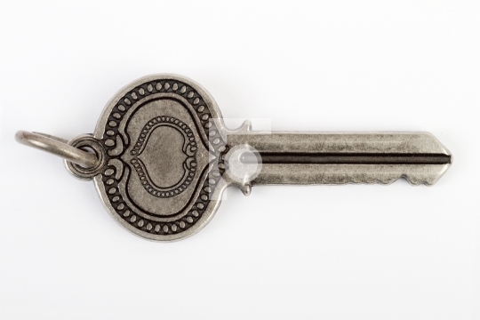 Old vintage key in white background