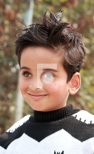 Smiling Indian Boy Kid during winter wearing sweater