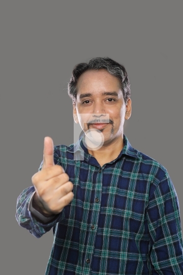 Smiling Indian Trader Man with Moustaches Showing Thumbs Up on G