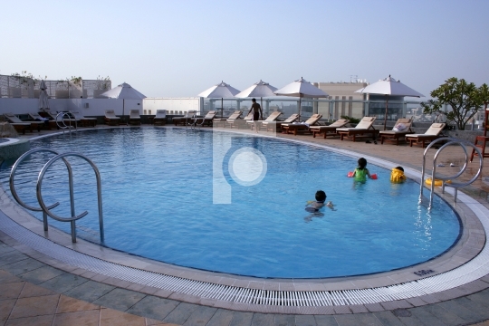 Swimming pool with kids playing