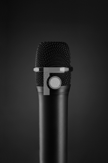 Wireless Black microphone on dark grey background
