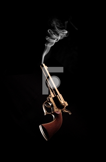 Vintage / Antique Gun and Smoke Coming Out on Black Background - Fotonium